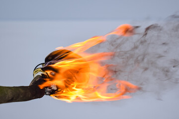 Torch fire against snow