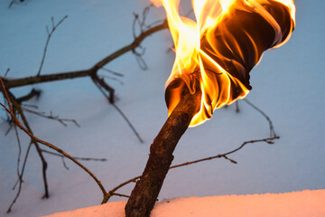 Torch against snow