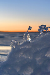 Winter ice against sunset sky