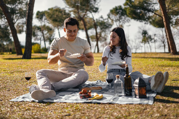 picnic concept, white couple eating rice in a picnic park