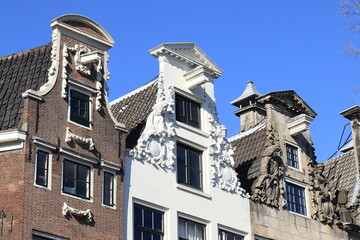 Fototapeta na wymiar Amsterdam Herengracht Canal Highly Decorated House Facades with Sculpted Details, Netherlands