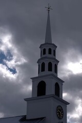 A church steeple on a cloudy cold winter day