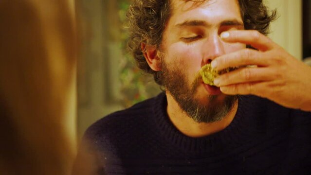 Man enjoys freshly cooked oysters at home