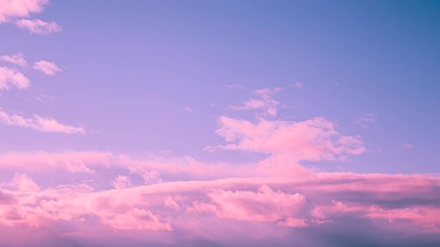 Toned blue pink magenta colors sky sunset sunrise background. Time Lapse Time-lapse Time-lapse Of Bright Toned pink Sky With White Fluffy Clouds. Cloudy Sky. Sunny Cloudscape.