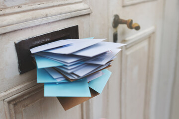 Jam-packed with the post. Cropped shot of letters in a letter box.