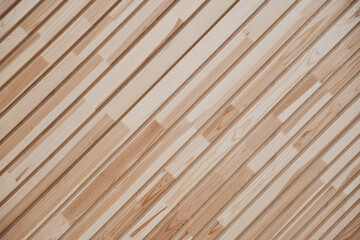 Close-up of clapboard wall. Fragment of diagonal wooden planks. Decorating material. Wood texture as background.