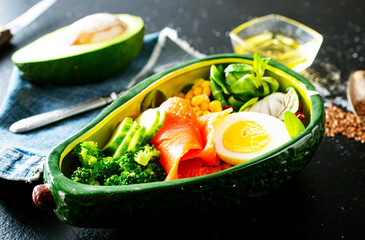 bowl with avocado, salmon, couscous and poached egg