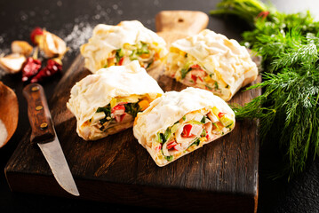 Lavash roll with crab, cheese and eggs, selective focus