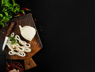 Slicing of boiled calamar on a cook-table © tycoon101