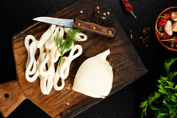 Slicing of boiled calamar on a cook-table © tycoon101
