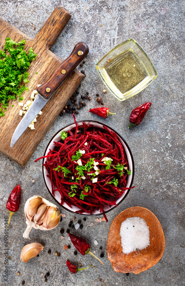 Sticker beetroot salad with oil and nuts in white bowl. selective focus.