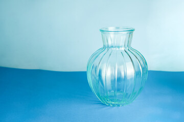 Empty ceramic flower pot, flower vase isolated on blue or light blue background.
