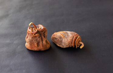 Dried dates on a black background. Its Turkish name is date palm.