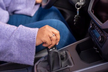 girl driving car moving transmission shift gear