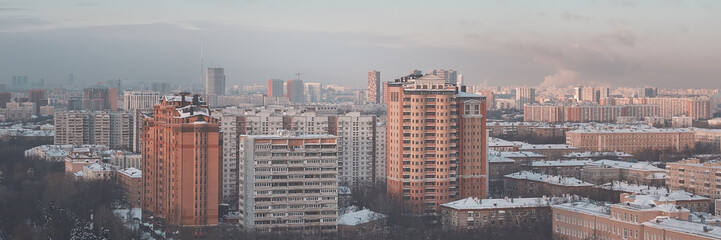 Fototapeta premium Urban areas and highways are covered with snow, aerial photography