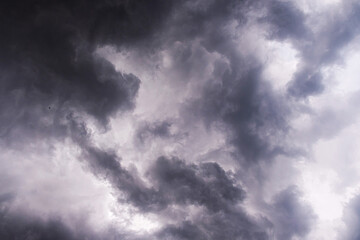 Naklejka na ściany i meble Overcast clouds. Storm sky, rainy clouds over horizon
