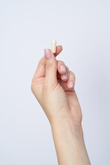 woman hand hold drag or medicine on white background