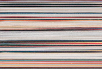 sheets of paper of various colors and thicknesses, cross section