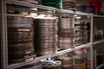 Film reels for old vintage cinema movie projector in video library.
