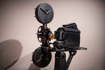 Closeup photo of old vintage movie projector in cinema library.