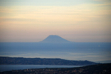 The island of Vulcano at sunset seen from mainland Italy