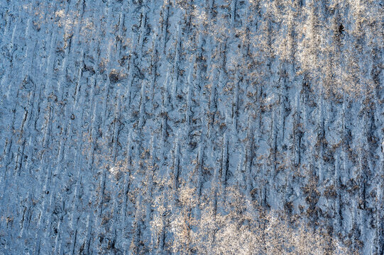 Top view of scarified and grooved concrete on a city road for overlay prep