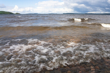 Seascape . Strong surf and wind. Rocky bottom