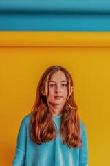 Girl for peace, stop war. Girl in a blue hoodie on a yellow and blue background.