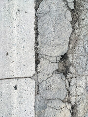 Pot hole and cracks in a road caused by heavy industrial loads