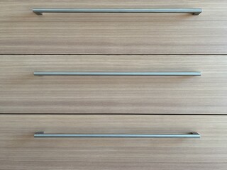 Wooden cabinet with stainless steel handles