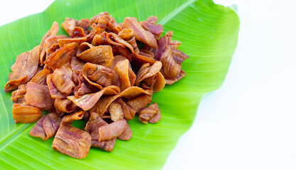 Banana slice chips banana leaf on white background.
