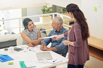 Obraz premium Their kick off meeting is in session. Shot of a team of colleagues having a meeting in a modern office.