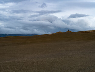 View on hills of Tuscany, Italy. Tuscan landscape with ploughed fields in autumn.