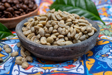 Green and roasted coffee beans from South America coffee producing region, from Colombia and Brazil with  mountain ranges and climate ideal for coffee growing