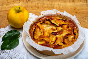 Baked apple cake with almond frangipani custard close up