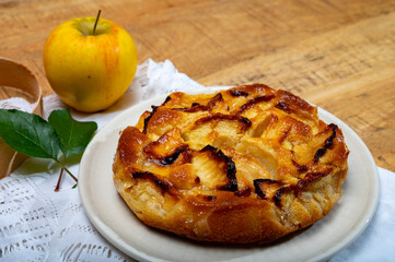 Baked apple cake with almond frangipani custard close up