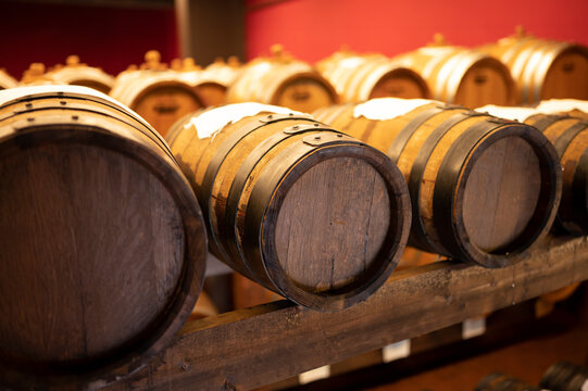 Traditional production and aging in wooden barrels of Italian Balsamic grapes vinegar dressing in Modena, Italy