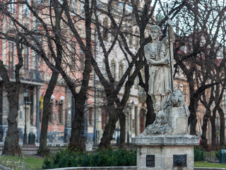 Fototapeta premium Lviv, Ukraine - February 2022: FOUNTAIN WITH SCULPTURE FIGURE OF ADONIS.