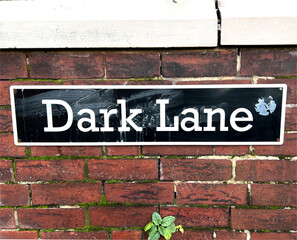 Street sign affixed to a red brick wall near, Pontefract, Yorkshire, UK
