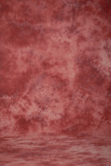 Dark red orange coral background, classic style paint stroke studio fabric background or backdrop.