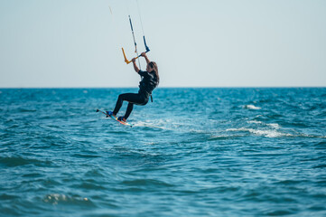 Woman kitesurfing on the ocean waters