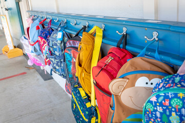 Classroom backpacks on Hooks outside of class