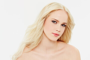 Fototapeta premium Shes got a face that could break hearts. Portrait of a beautiful blonde against a white background.