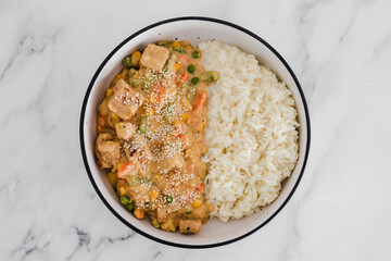 vegan satay veggie stir fry with coconut milk rice, healthy plant-based food
