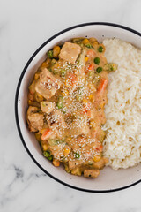 vegan satay veggie stir fry with coconut milk rice, healthy plant-based food