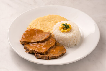 roast beef with rice and mashed potatoes