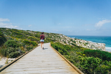 Woman walking on path at Seal bay on Kangaroo Island, South Australia