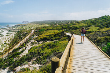 Woman walking down the pathway at Seal bay on Kangaroo Island, South Australia