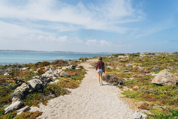 Woman walking near Vivonne Bay Jetty on kangaroo Island, South Australia