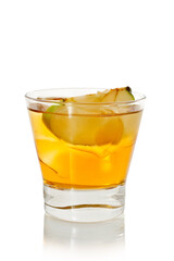 Glass of yellow alcohol cocktail with ice and slice of apple on white background